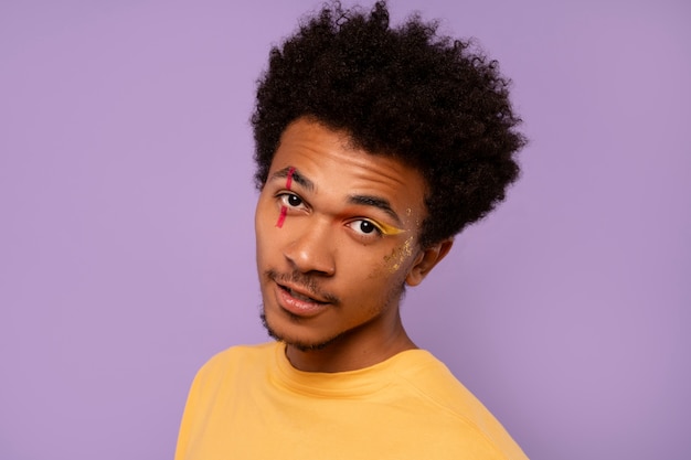 Side view man with graphic eye makeup