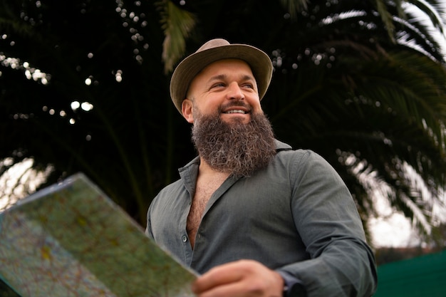 Side view man with map outdoors