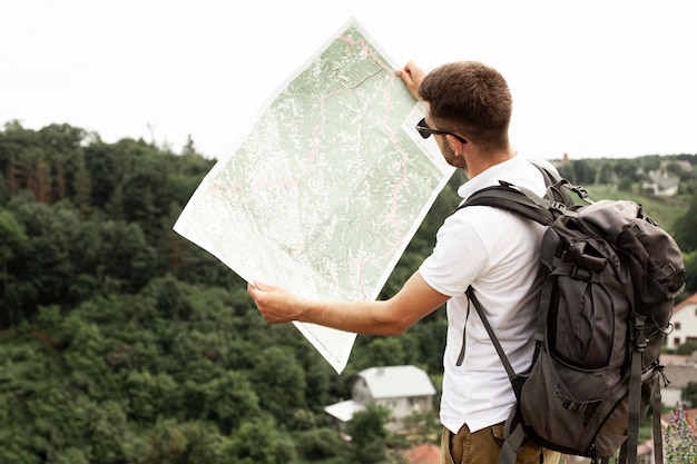 Side view man with map