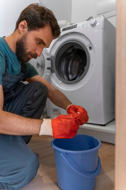 Free photo side view man working as plumber