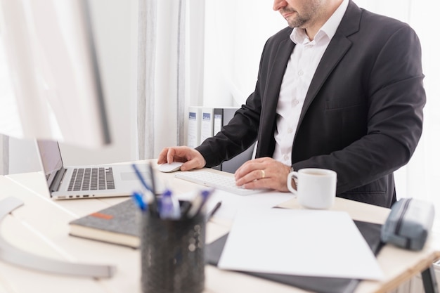 Side view man working at a business company