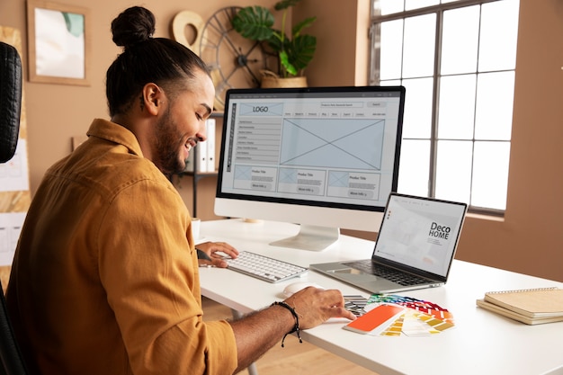 Side view man working at desk