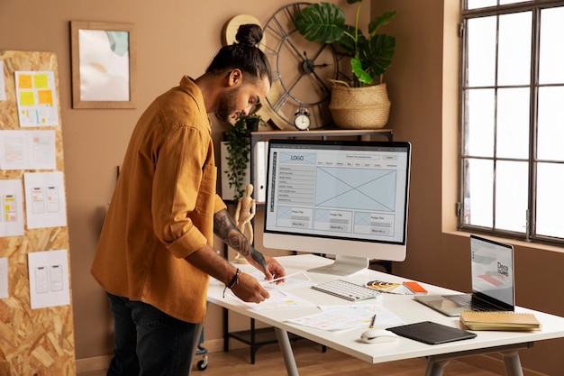 Side view man working at desk