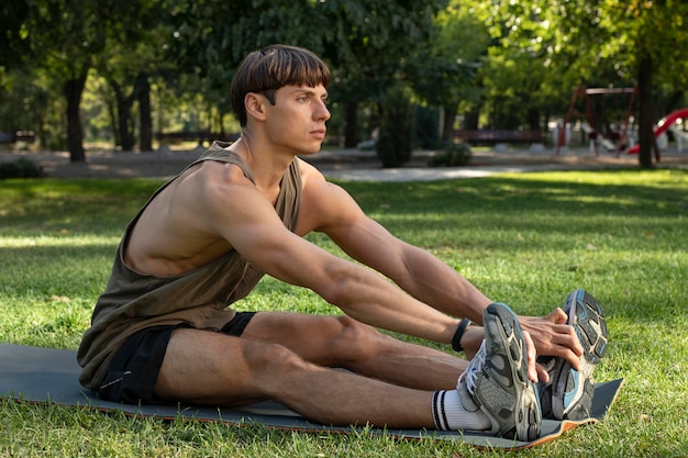 Free photo side view of man working out in nature