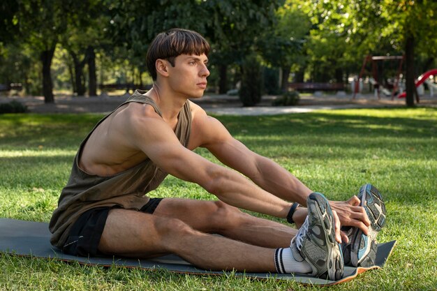 Side view of man working out in nature