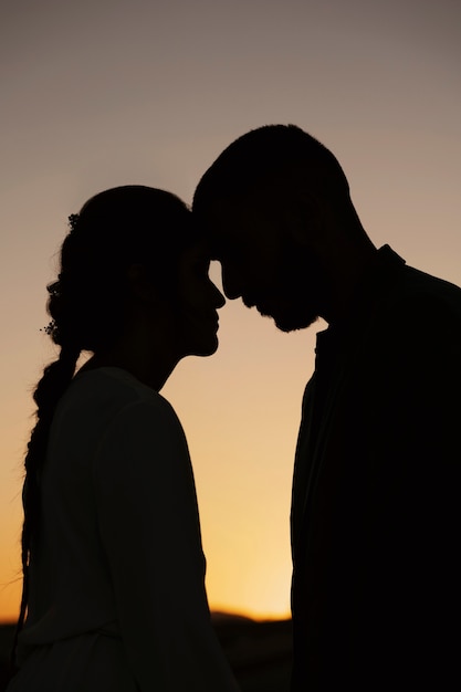 Side view married couple silhouettes