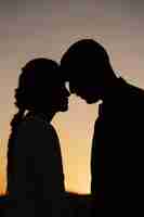 Free photo side view married couple silhouettes