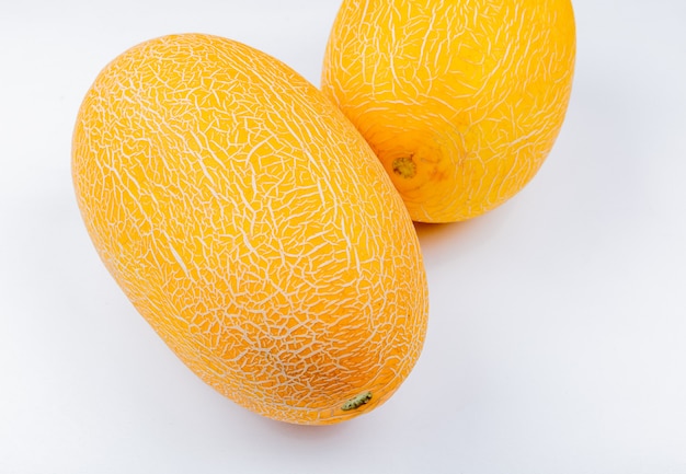 Side view of melons on white background