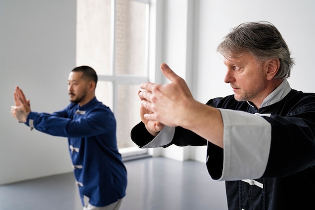 Side view men training together