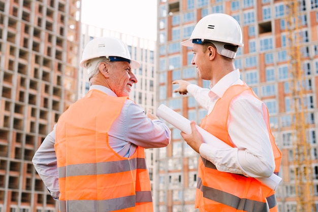 Side view men with safety equipment 