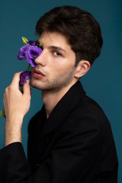 Side view model holding purple flower