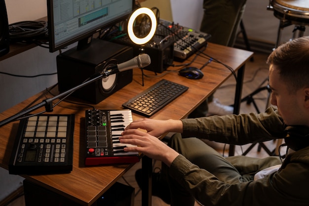 Side view musician working in studio