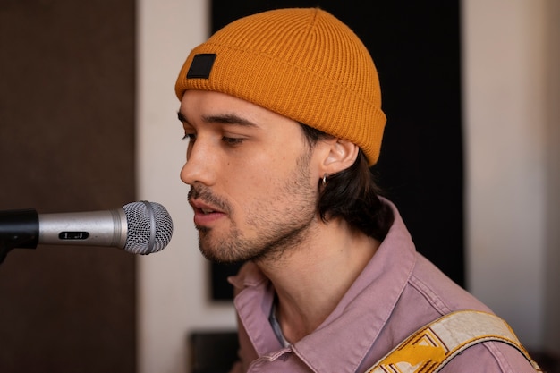 Side view musician working in studio