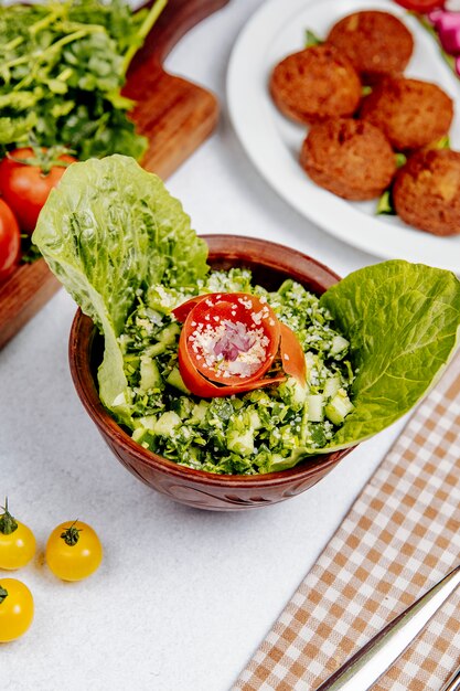 Side view ofsalad with quinoa tomatoes and cucumbers