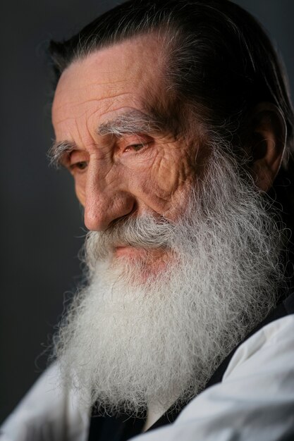 Side view old man with long beard