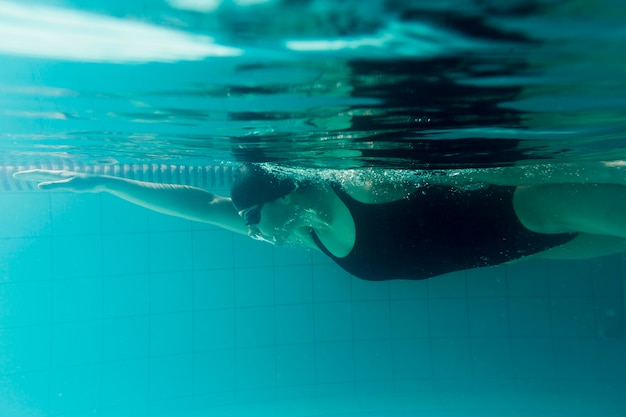 Side view of olympic swimmer training