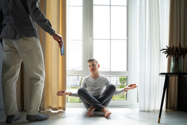 Side view parent taking phone from kid