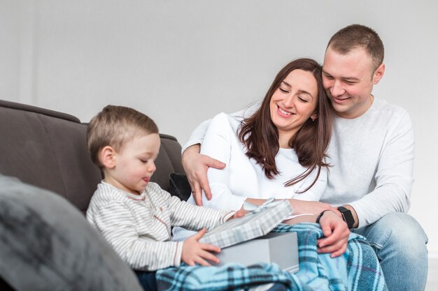 Free photo side view of parents with baby