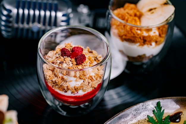 Side view parfait with yogurt muesli and raspberry