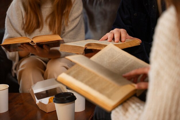 Side view people holding books