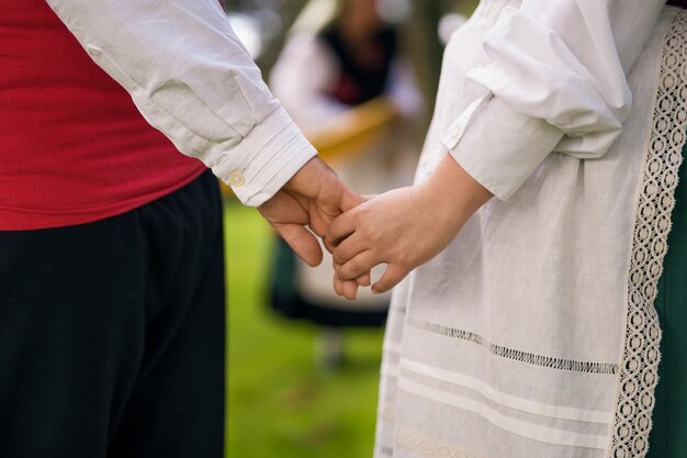 Side view people holding hands