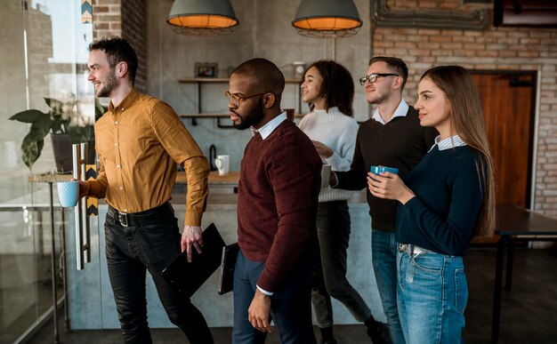 side view of people meeting over coffee