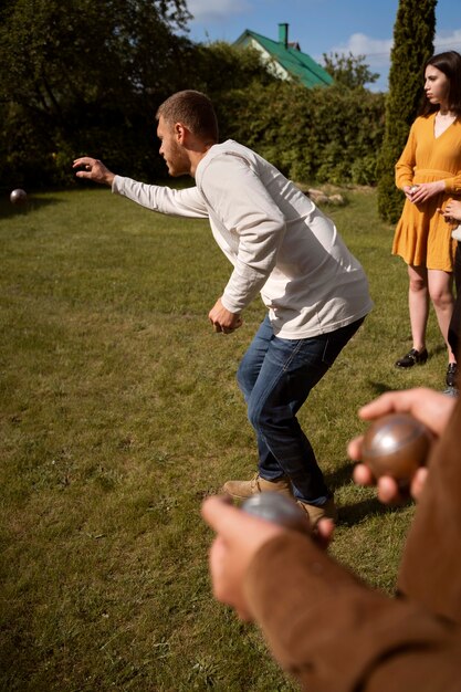 Side view people playing sport with balls