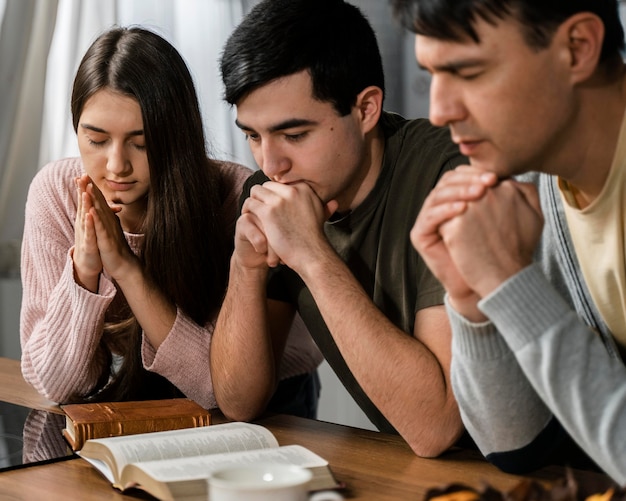 Side view of people praying together