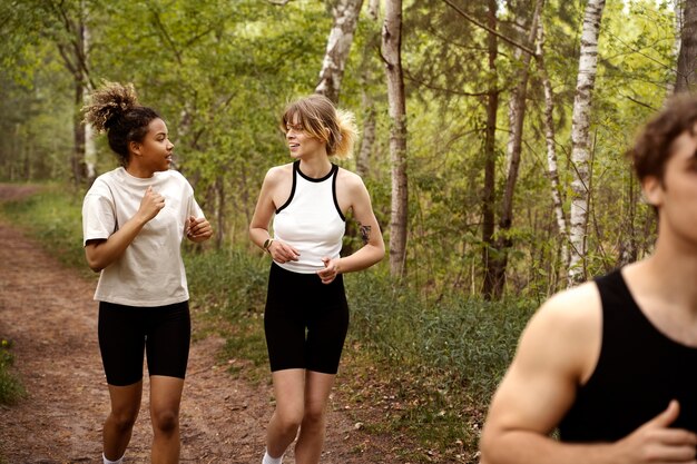 Side view people running together