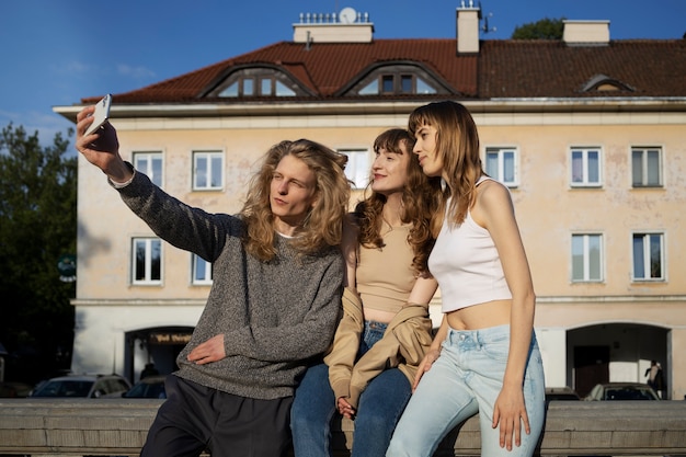 Side view people taking selfie