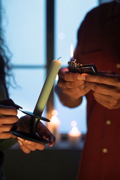 Side view people with candle and lighter