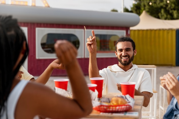 Side view people with tasty food