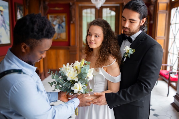 Side view photographer holding flowers