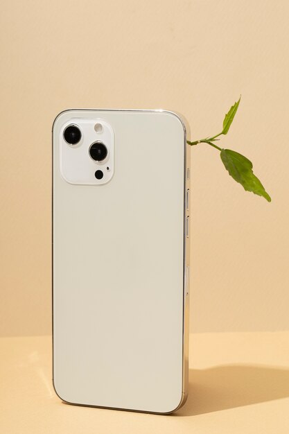 Side view of a plant growing on a smartphone