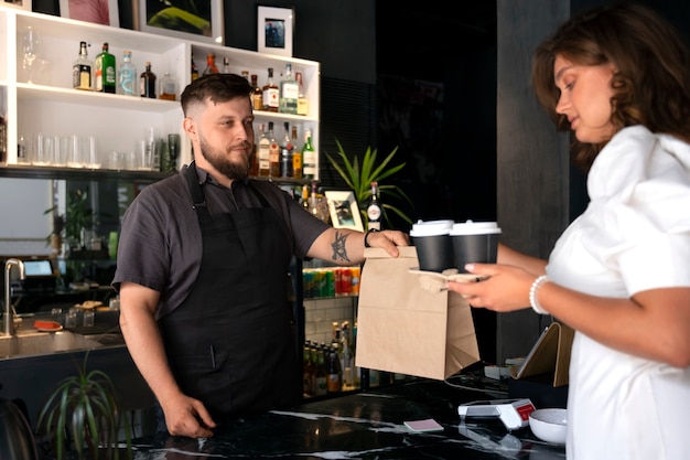 Side view plus-size man working as barista