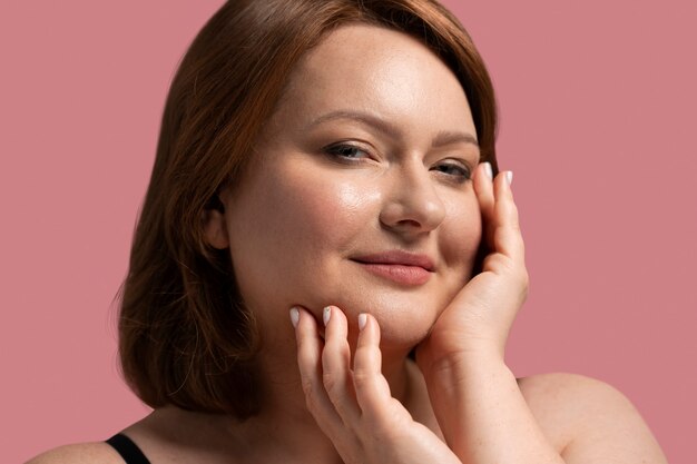 Side view plus size model posing in studio