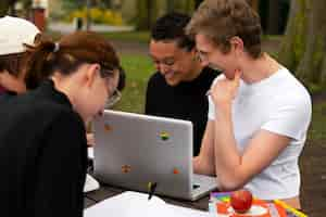 Free photo side view queer students outdoors