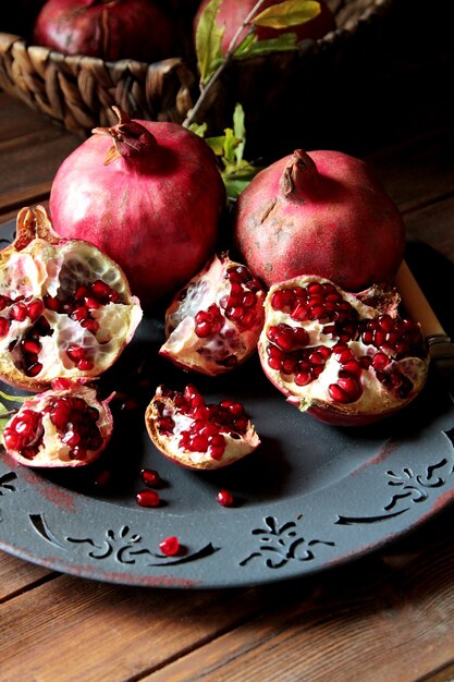 Side view ripe pomegranates with a branch from a tree