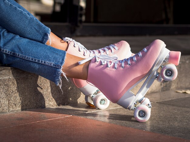 Side view of roller skates on pavement