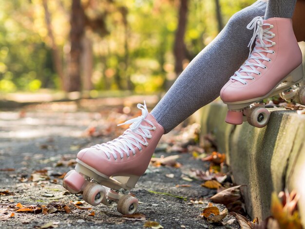 Side view of roller skates with leaves