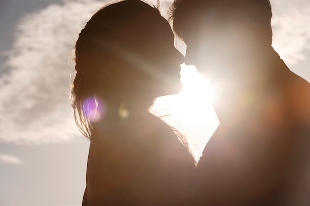 Side view romantic couple silhouettes