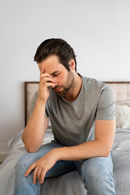 Free photo side view sad man dealing with std