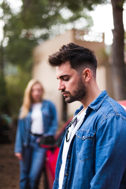 Free photo side view of a sad young man