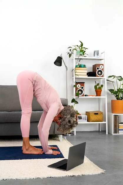 Side view senior woman exercising indoors