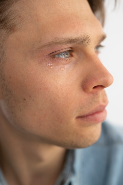 Side view sensitive man crying
