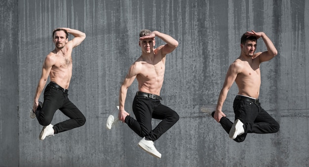 Free photo side view of shirtless hip hop dancers posing while dancing