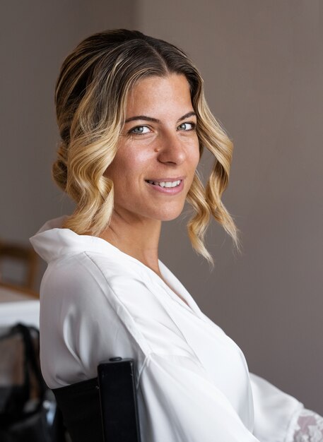 Side view smile bride on chair