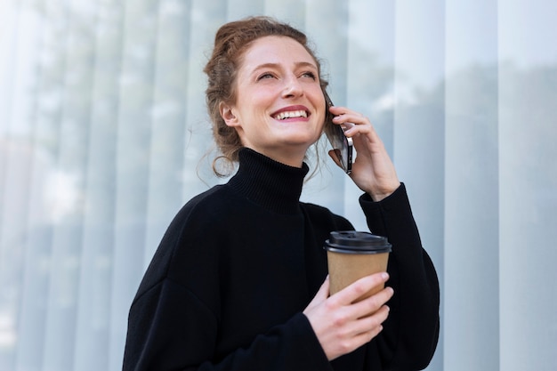 Side view smiley business woman talking on phone