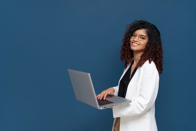 Side view smiley business woman with laptop