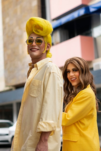 Side view smiley drag queens posing